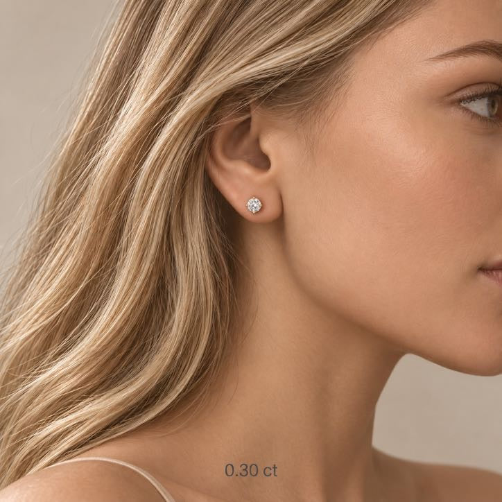 Pure Solitaire Stud Earrings, close view of the diamond and the 18K gold setting