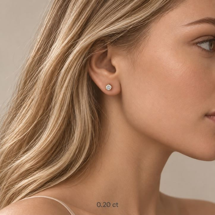 Pure Solitaire Stud Earrings in solid 18K gold, diamond solitaire on a four-prong mount