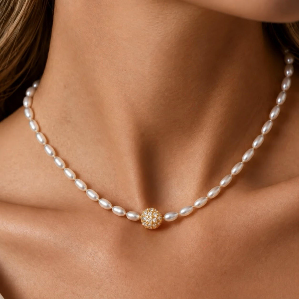 Oval freshwater pearl necklace with a pavé diamond sphere centre in 18K gold